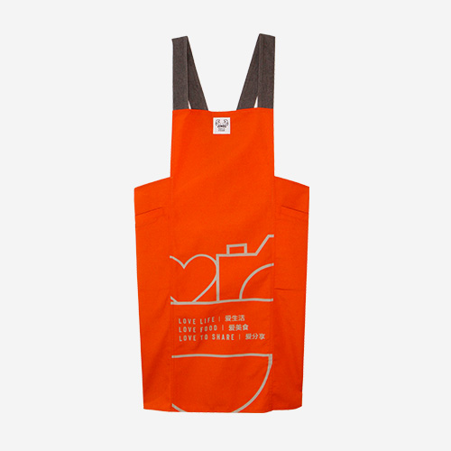 Love, Afare Kitchen Apron in vibrant orange – durable, stylish, and functional apron with side pockets for home cooks and bakers.