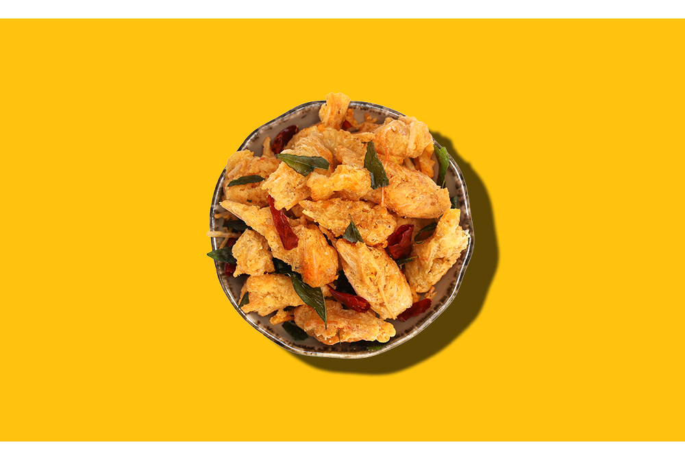 Salted Egg Prawn Chins – Crispy and savoury prawn chins coated in rich salted egg yolk, enhanced with aromatic curry leaves and a hint of spice for the perfect snack.